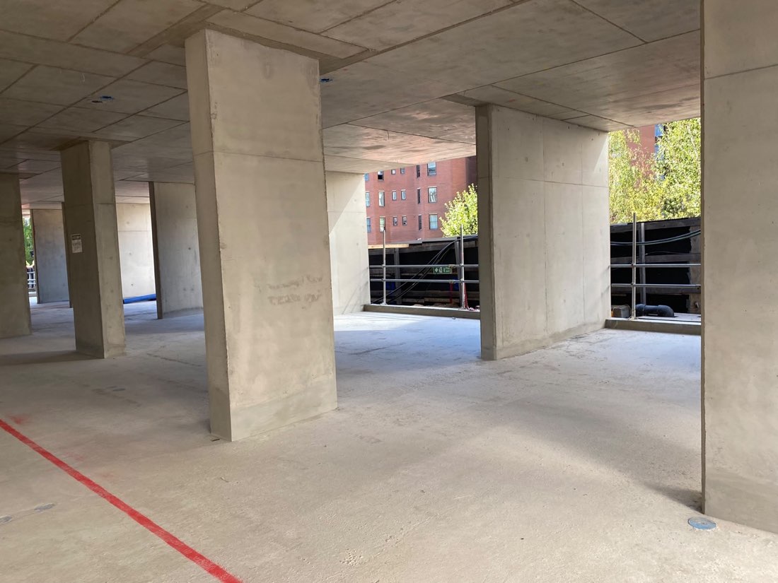 Completed reinforced concrete floor and columns on an active project