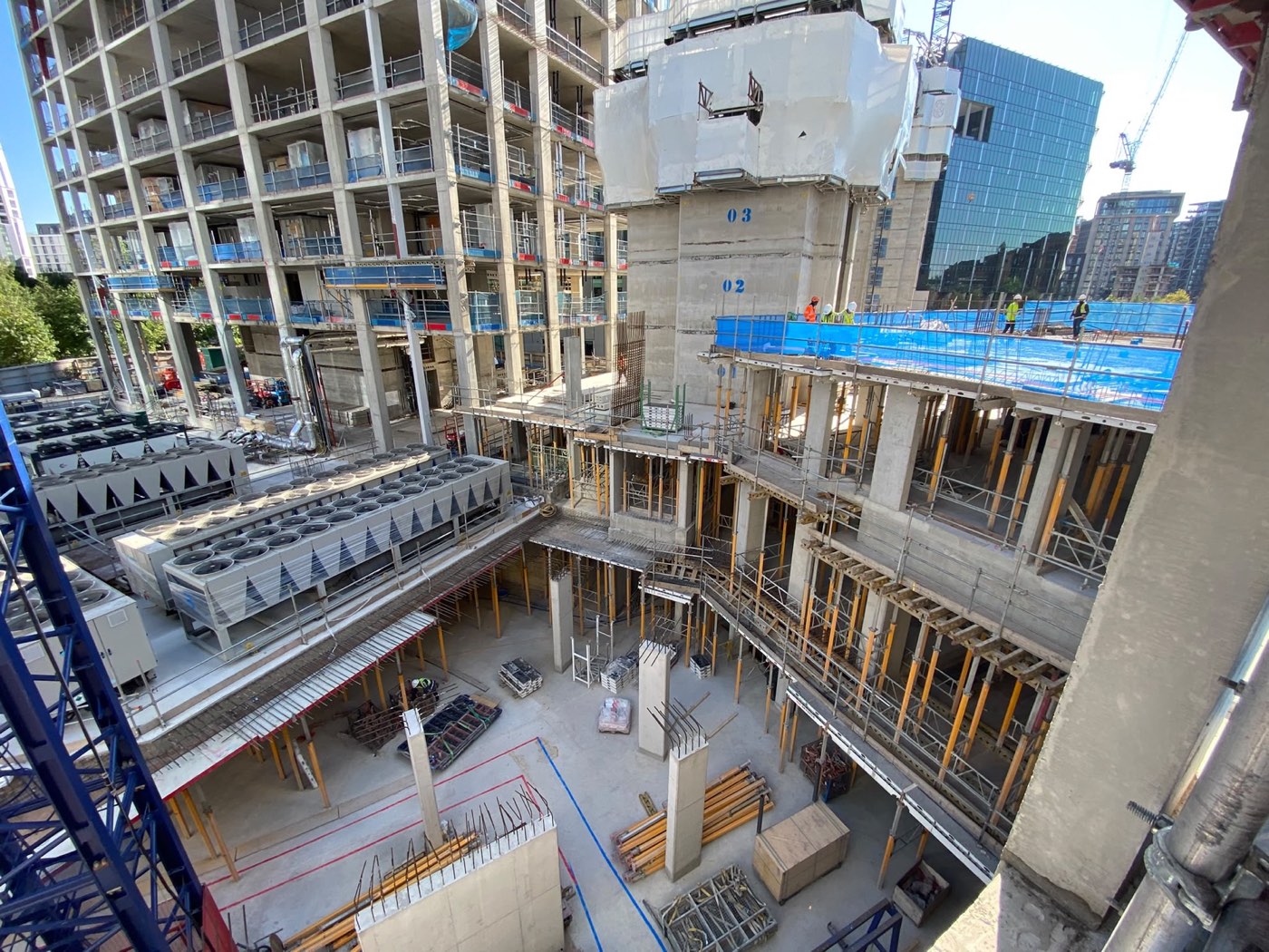 Aerial view of a high-rise concrete frame under construction